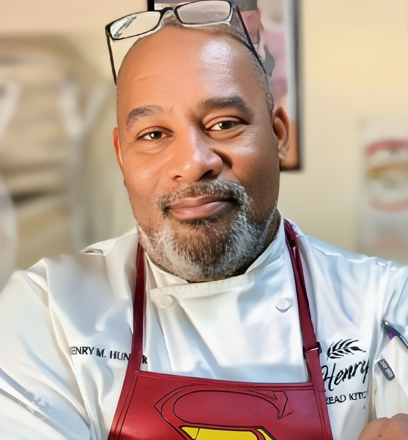 Henry M. Hunter in his kitchen wearing chef's apron